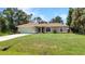 Charming one-story home with well-maintained lawn and a spacious driveway at 3305 Nansen Ln, North Port, FL 34286