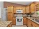 Kitchen featuring stainless steel appliances, granite countertops and tile backsplash at 3305 Nansen Ln, North Port, FL 34286