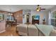 Open concept living area seamlessly connects the living room to the dining space, creating an inviting atmosphere at 3305 Nansen Ln, North Port, FL 34286