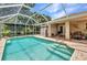 Sparkling pool surrounded by lush landscaping offers the ultimate private backyard oasis at 3305 Nansen Ln, North Port, FL 34286