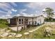 A backyard featuring a patio area, and a fenced in yard at 3497 Cohoes St, Port Charlotte, FL 33952