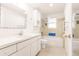 A bright bathroom with a tub and shower at 3497 Cohoes St, Port Charlotte, FL 33952