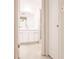 Clean bathroom featuring a mirror, sleek vanity with cabinet storage, and a shower at 3497 Cohoes St, Port Charlotte, FL 33952