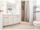 Bathroom with tile shower, toilet, and vanity providing essential amenities at 3497 Cohoes St, Port Charlotte, FL 33952