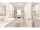 A bright bathroom with a tub and shower at 3497 Cohoes St, Port Charlotte, FL 33952