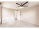 A neutral bedroom featuring a ceiling fan and ample space at 3497 Cohoes St, Port Charlotte, FL 33952