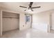 A bright bedroom featuring ceiling fan, a closet, and a window at 3497 Cohoes St, Port Charlotte, FL 33952