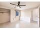 A bright bedroom featuring ceiling fan, a closet, and a window at 3497 Cohoes St, Port Charlotte, FL 33952