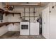 A garage featuring a washer and dryer set at 3497 Cohoes St, Port Charlotte, FL 33952