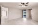 The open living room offers backyard access and access to other rooms in the home at 3497 Cohoes St, Port Charlotte, FL 33952