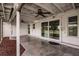 Covered patio with concrete flooring, ceiling fans, and sliding glass doors to the backyard at 3497 Cohoes St, Port Charlotte, FL 33952