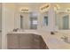 Double vanity bathroom with plenty of counter space, storage and stylish lights at 4038 Corydon Ave, North Port, FL 34286