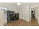Bright bedroom with hardwood floors, ceiling fan, closet, and natural light from the window at 4038 Corydon Ave, North Port, FL 34286
