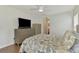 Bright bedroom features hardwood floors, ceiling fan, and neutral colors at 4038 Corydon Ave, North Port, FL 34286