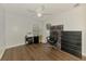 Bedroom/office space with wood floors, ceiling fan, and neutral colors at 4038 Corydon Ave, North Port, FL 34286