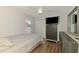 Bedroom featuring wood floors, closet and ceiling fan at 4038 Corydon Ave, North Port, FL 34286