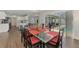 Dining room leading to a screened-in patio with a pool, creating an inviting indoor-outdoor flow at 4038 Corydon Ave, North Port, FL 34286
