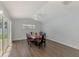 Bright dining room adjacent to the lanai and pool, complete with modern furniture and plenty of natural light at 4038 Corydon Ave, North Port, FL 34286