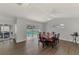 Elegant dining room overlooking the pool and lanai, perfect for entertaining and enjoying indoor-outdoor living at 4038 Corydon Ave, North Port, FL 34286