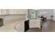 Kitchen with granite counters, sleek appliances, and direct view into the dining area at 4038 Corydon Ave, North Port, FL 34286