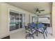 Enjoy outdoor dining on this covered patio featuring a table and chairs, next to the sparkling pool at 4038 Corydon Ave, North Port, FL 34286