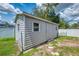 Durable outdoor storage shed in backyard with ample storage space for your tools and equipment at 4038 Corydon Ave, North Port, FL 34286