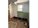 Bathroom mid-renovation, featuring exposed plumbing and a vintage-style sink at 420 W Olympia Ave, Punta Gorda, FL 33950
