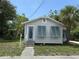 Inviting single-story home with a front entrance featuring charming teal shutters at 420 W Olympia Ave, Punta Gorda, FL 33950