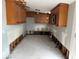 Interior shot of a kitchen with cabinetry needing renovation at 420 W Olympia Ave, Punta Gorda, FL 33950
