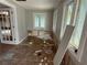 View of a room with damage, two large windows, and french doors at 420 W Olympia Ave, Punta Gorda, FL 33950