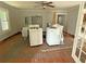 View of a living room needing renovation with appliances present at 420 W Olympia Ave, Punta Gorda, FL 33950