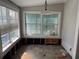 Sunroom needing renovation with large windows at 420 W Olympia Ave, Punta Gorda, FL 33950