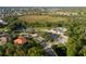Aerial view showcases the community amenities including pools, tennis courts, and lush landscaping at 4334 Corso Venetia Blvd, Venice, FL 34293
