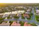 Expansive aerial view of a beautiful, lakeside community with well-maintained homes and lush tropical landscaping at 4334 Corso Venetia Blvd, Venice, FL 34293