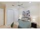 Comfortable bedroom boasts neutral walls, carpet, and a ceiling fan, ensuring a relaxing space for rest and rejuvenation at 4334 Corso Venetia Blvd, Venice, FL 34293