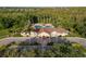 Stunning aerial view of the community clubhouse, pool, and elegant landscaping, creating a luxurious ambiance at 4334 Corso Venetia Blvd, Venice, FL 34293