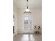 Welcoming foyer with tile floors, beautiful front door, and lots of natural light at 4334 Corso Venetia Blvd, Venice, FL 34293
