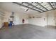 Spacious two car garage with epoxy floors and ample storage racks at 4334 Corso Venetia Blvd, Venice, FL 34293