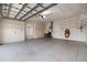 Spacious two car garage with epoxy floors and ample storage racks at 4334 Corso Venetia Blvd, Venice, FL 34293