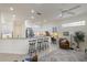 Open kitchen featuring stainless steel appliances, and a breakfast bar overlooking the living space at 4334 Corso Venetia Blvd, Venice, FL 34293