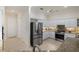 Bright kitchen features stainless steel appliances, granite countertops, and stylish white cabinetry at 4334 Corso Venetia Blvd, Venice, FL 34293