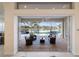 Inviting lanai area features comfortable seating and serene water views at 4334 Corso Venetia Blvd, Venice, FL 34293