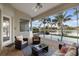 Relaxing lanai features a beautiful waterfront view, comfortable seating, and a serene atmosphere at 4334 Corso Venetia Blvd, Venice, FL 34293