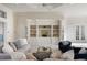 Inviting living space with comfortable seating, built-in shelving, and ample natural light at 4334 Corso Venetia Blvd, Venice, FL 34293