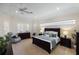 Relaxing primary bedroom with neutral colors, plantation shutters, and recessed lighting at 4334 Corso Venetia Blvd, Venice, FL 34293