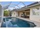 Spacious screened pool area with patio, outdoor seating, and seamless access to the home's interior, perfect for entertaining at 4334 Corso Venetia Blvd, Venice, FL 34293