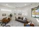 Comfortable sitting room with bright windows and a view of the beautiful landscaping at 4334 Corso Venetia Blvd, Venice, FL 34293