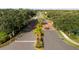Aerial view of a well-manicured community street with palm trees and landscaping at 4334 Corso Venetia Blvd, Venice, FL 34293