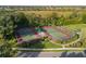 Aerial view of tennis and bocce ball courts in a well-maintained community at 4334 Corso Venetia Blvd, Venice, FL 34293