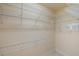 Spacious walk-in closet featuring white wire shelving for ample storage space at 4334 Corso Venetia Blvd, Venice, FL 34293